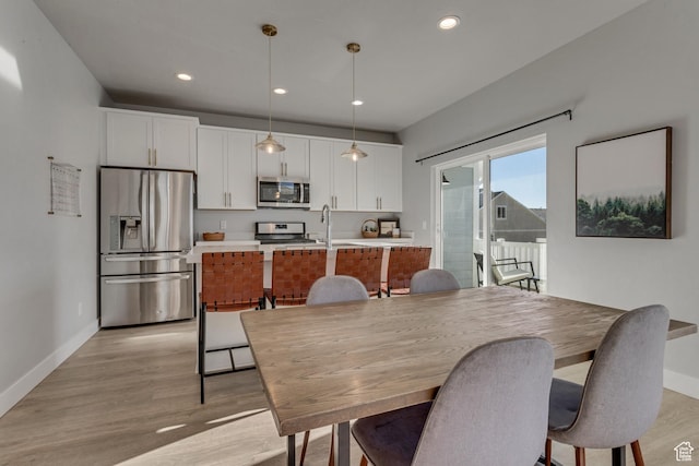 9757 N Aaron Ave E Unit 204, Eagle Mountain, UT 84005 - dining space with light wood-style flooring and recessed lighting
