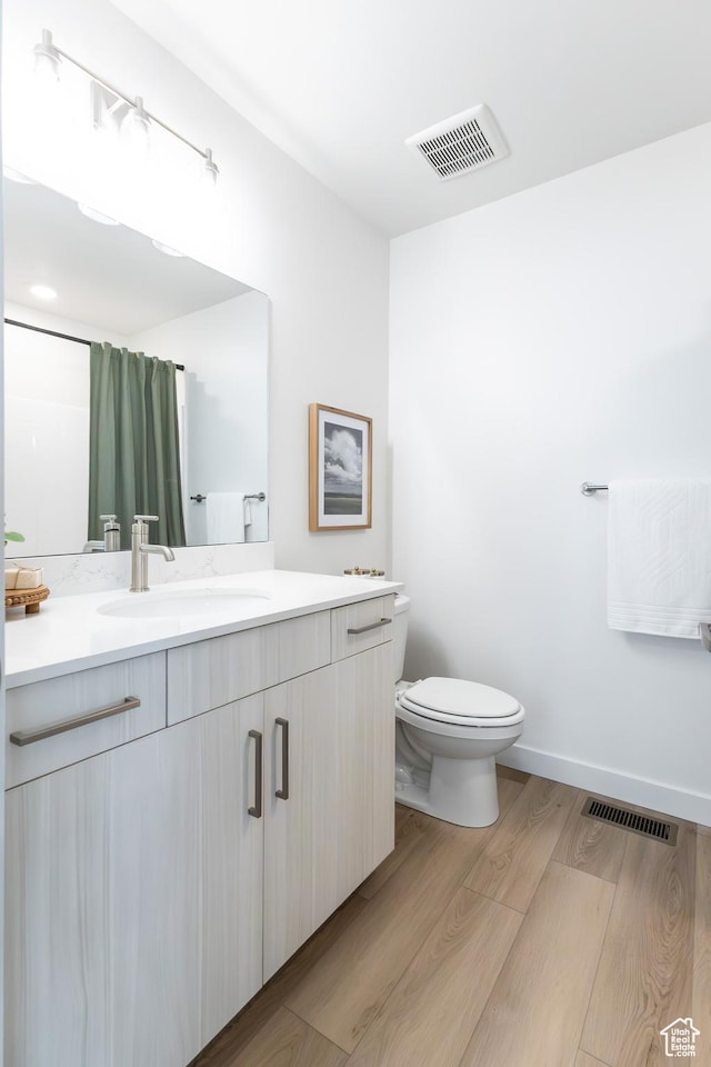 2741 N 2775 W Unit 125, Plain City, UT 84404 - full bathroom featuring vanity, wood finished floors, and a shower with shower curtain