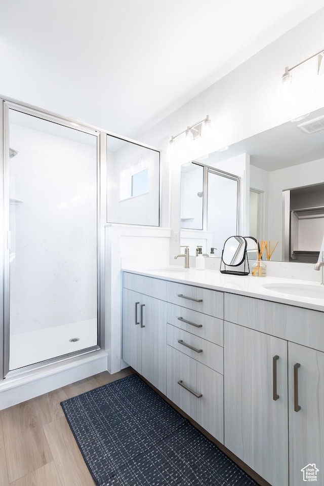 2741 N 2775 W Unit 125, Plain City, UT 84404 - full bath with double vanity, a stall shower, and wood finished floors