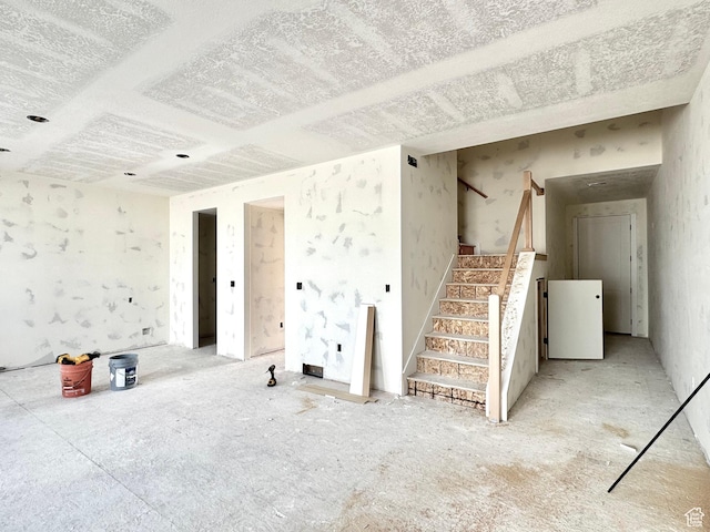 2741 N 2775 W Unit 125, Plain City, UT 84404 - unfurnished living room with stairway