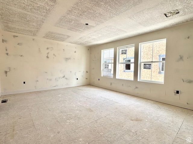 2741 N 2775 W Unit 125, Plain City, UT 84404 - spare room with a textured ceiling