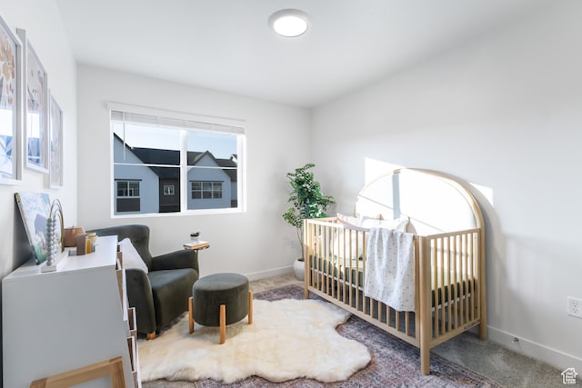 2741 N 2775 W Unit 125, Plain City, UT 84404 - bedroom with carpet and a crib
