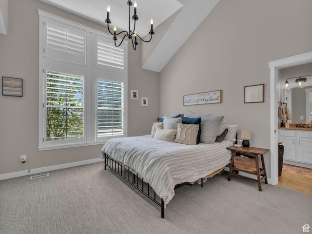 10298 S Otter Trail Dr, South Jordan, UT 84095 - bedroom featuring a chandelier, light carpet, high vaulted ceiling, and ensuite bath