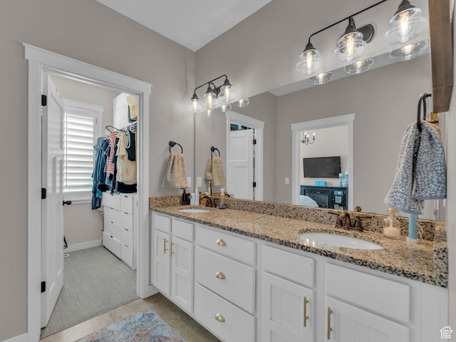 10298 S Otter Trail Dr, South Jordan, UT 84095 - full bathroom with double vanity, tile patterned flooring, and a spacious closet