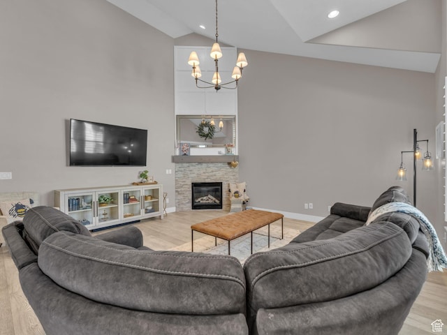 10298 S Otter Trail Dr, South Jordan, UT 84095 - living room with high vaulted ceiling, a chandelier, wood finished floors, and a fireplace