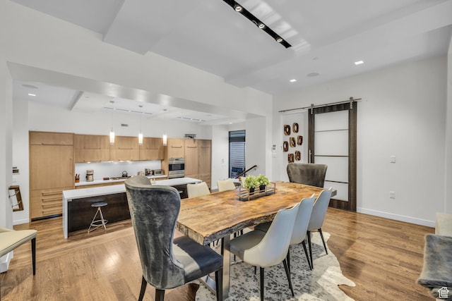 333 Main St Unit 10, Park City, UT 84060 - dining area featuring light wood-style flooring, a barn door, and recessed lighting
