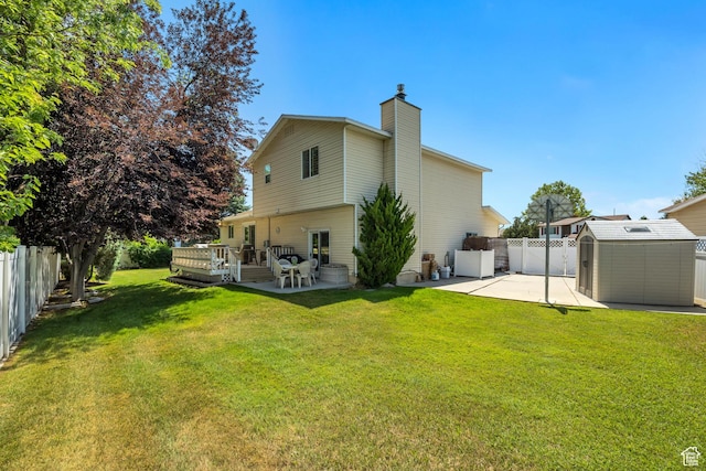 7305 S Autumn Meadow Cir W, West Jordan, UT 84084 - rear view of house featuring a storage unit, a chimney, a fenced backyard, and a wooden deck