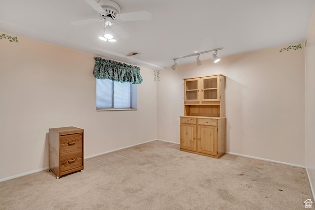 7305 S Autumn Meadow Cir W, West Jordan, UT 84084 - unfurnished room featuring rail lighting, ceiling fan, and light colored carpet