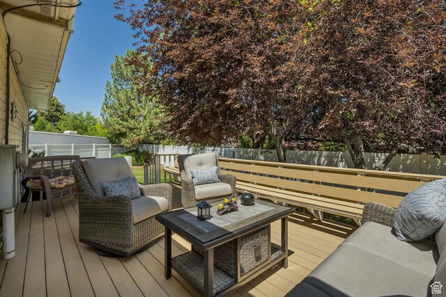 7305 S Autumn Meadow Cir W, West Jordan, UT 84084 - wooden deck with a fenced backyard and outdoor lounge area