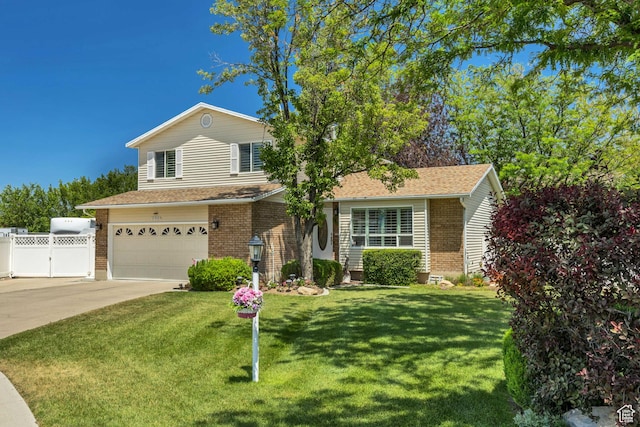 7305 S Autumn Meadow Cir W, West Jordan, UT 84084 - view of front of property with a garage, brick siding, concrete driveway, and a gate