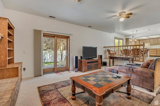 7305 S Autumn Meadow Cir W, West Jordan, UT 84084 - living room with a ceiling fan, light carpet, and a chandelier