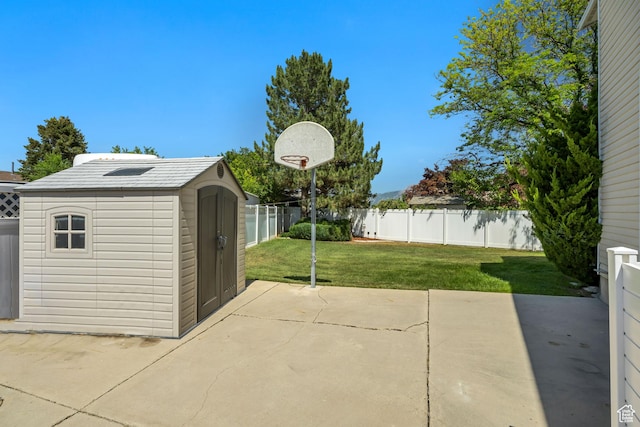 7305 S Autumn Meadow Cir W, West Jordan, UT 84084 - fenced backyard with a storage shed and a patio area