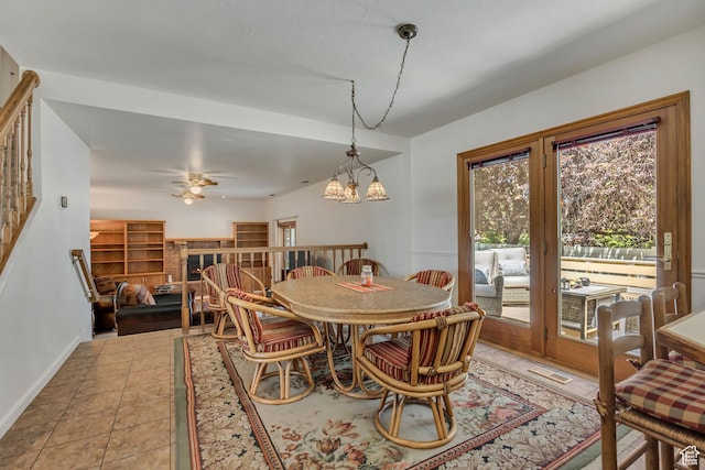 7305 S Autumn Meadow Cir W, West Jordan, UT 84084 - dining room featuring a brick fireplace, a ceiling fan, a chandelier, and light tile patterned floors