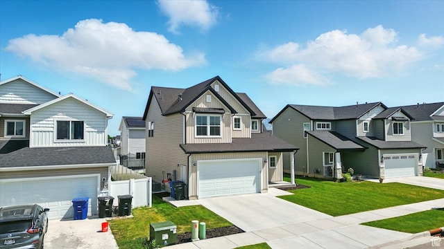 1469 W 2200 S, Wellsville, UT 84339 - view of front of house with board and batten siding, a residential view, a garage, and driveway