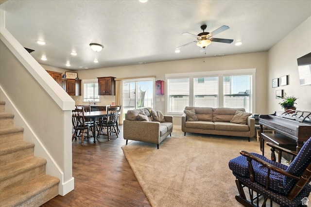 1469 W 2200 S, Wellsville, UT 84339 - living area with wood finished floors, ceiling fan, stairs, and recessed lighting