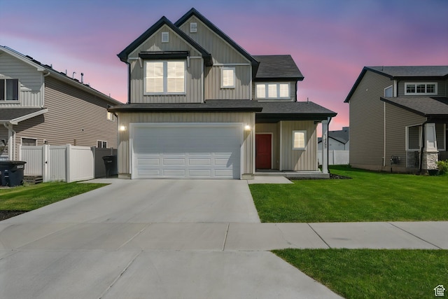 1469 W 2200 S, Wellsville, UT 84339 - view of front of home with board and batten siding, an attached garage, and concrete driveway