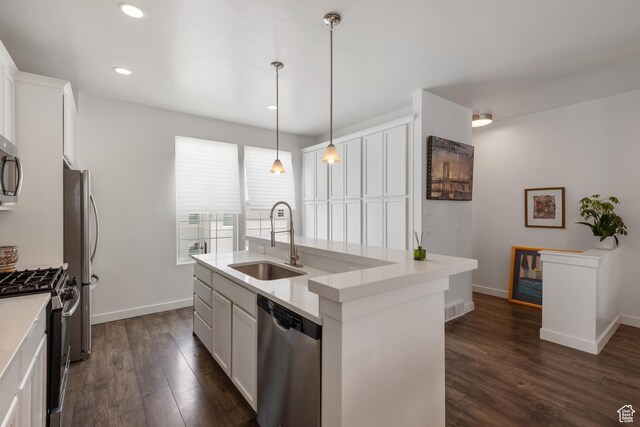 5359 W Bowstring Way Unit 358, South Jordan, UT 84009 - kitchen featuring appliances with stainless steel finishes, dark wood-style floors, a kitchen island with sink, white cabinets, and recessed lighting