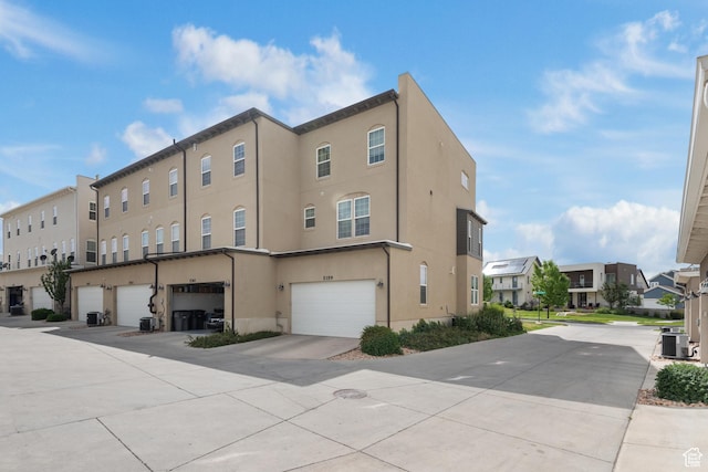 5359 W Bowstring Way Unit 358, South Jordan, UT 84009 - view of building exterior featuring a residential view and a garage