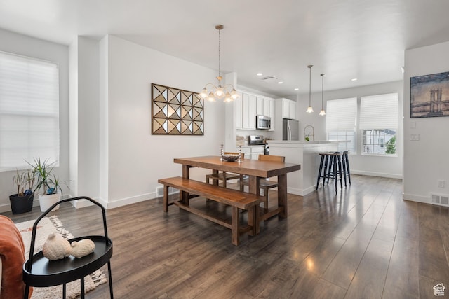 5359 W Bowstring Way Unit 358, South Jordan, UT 84009 - dining area featuring dark wood-style flooring, recessed lighting, and a chandelier