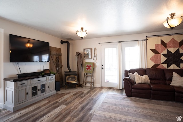 1075 E 2600 N, North Ogden, UT 84414 - living room featuring a wood stove and wood finished floors