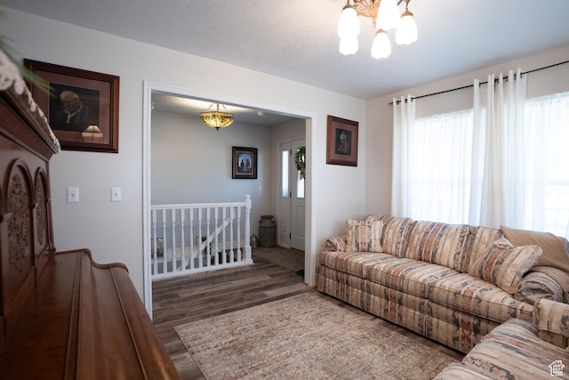 1075 E 2600 N, North Ogden, UT 84414 - living room featuring a chandelier and wood finished floors