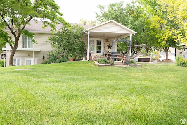 1075 E 2600 N, North Ogden, UT 84414 - view of green lawn with a garden