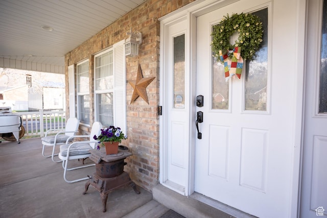 1075 E 2600 N, North Ogden, UT 84414 - view of exterior entry with covered porch and brick siding