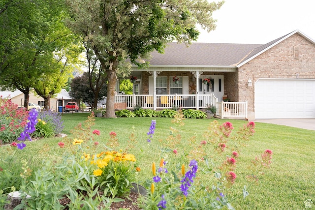 1075 E 2600 N, North Ogden, UT 84414 - single story home with covered porch, an attached garage, brick siding, a front yard, and driveway