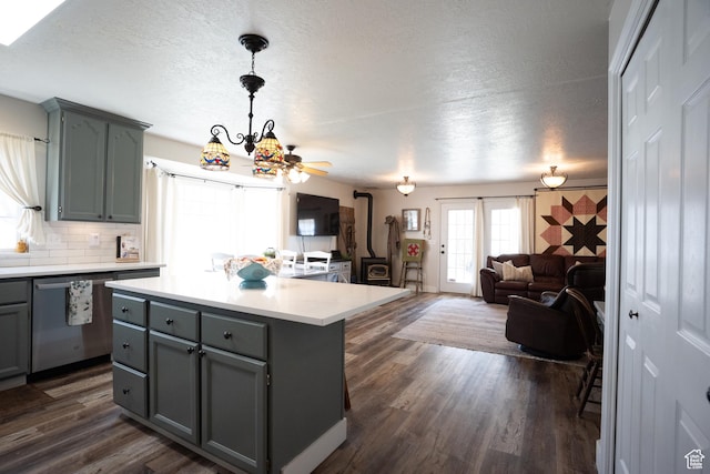 1075 E 2600 N, North Ogden, UT 84414 - kitchen with gray cabinetry, stainless steel dishwasher, a textured ceiling, light countertops, and tasteful backsplash