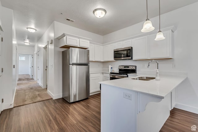 776 N 260 W, Vineyard, UT 84059 - kitchen with appliances with stainless steel finishes, a peninsula, dark wood finished floors, and white cabinets