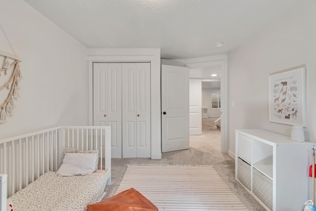 442 N Cowan Cir E, Payson, UT 84651 - bedroom featuring a closet, light colored carpet, and a textured ceiling