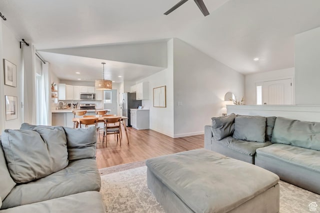 442 N Cowan Cir E, Payson, UT 84651 - living area with light wood finished floors, lofted ceiling, ceiling fan, recessed lighting, and healthy amount of natural light
