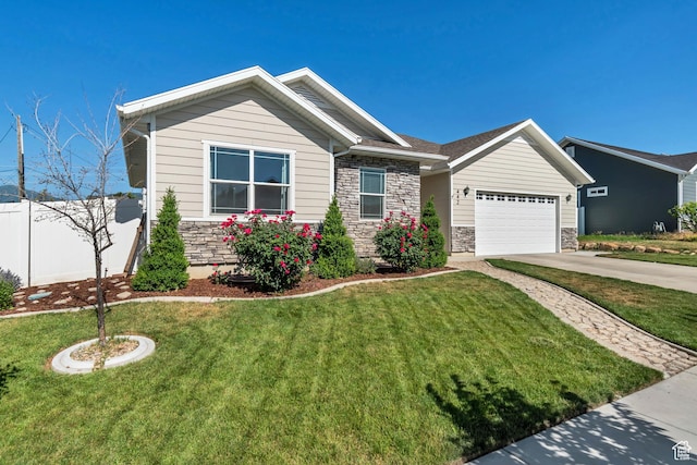 442 N Cowan Cir E, Payson, UT 84651 - view of front facade featuring stone siding, concrete driveway, and a garage