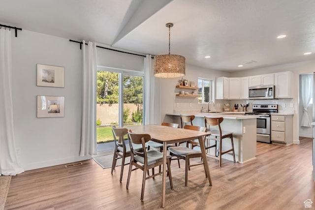 442 N Cowan Cir E, Payson, UT 84651 - dining space with recessed lighting, light wood-style floors, and a barn door