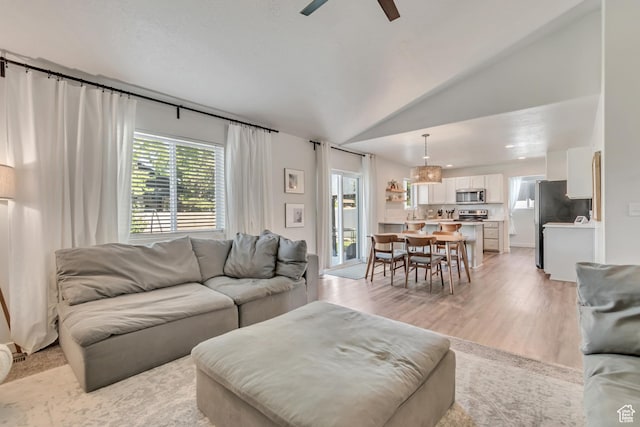 442 N Cowan Cir E, Payson, UT 84651 - living room with lofted ceiling, ceiling fan, and light wood finished floors