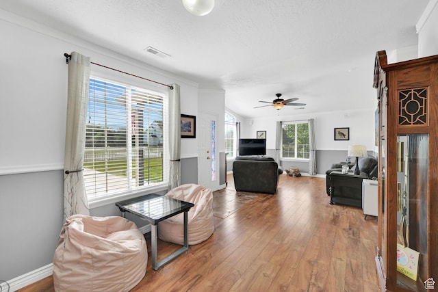 3139 N Pelican Dr, Farr West, UT 84404 - living room featuring hardwood / wood-style floors, a textured ceiling, and a ceiling fan
