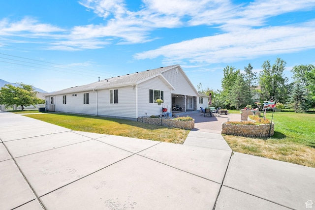 3139 N Pelican Dr, Farr West, UT 84404 - view of front of home featuring a patio area and a front yard