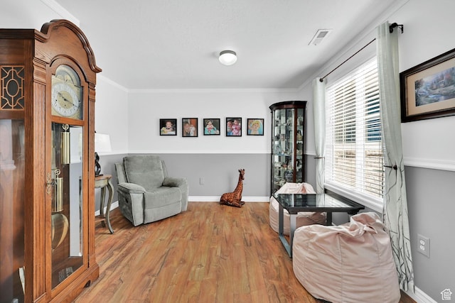 3139 N Pelican Dr, Farr West, UT 84404 - sitting room featuring wood finished floors and ornamental molding