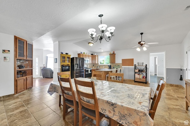3139 N Pelican Dr, Farr West, UT 84404 - dining area with a ceiling fan, a chandelier, vaulted ceiling, and a textured ceiling