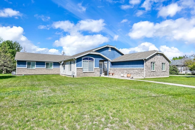 3139 N Pelican Dr, Farr West, UT 84404 - ranch-style house featuring brick siding and a front lawn