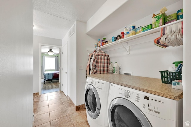 3139 N Pelican Dr, Farr West, UT 84404 - laundry area featuring washing machine and dryer, a textured ceiling, ceiling fan, and light tile patterned floors