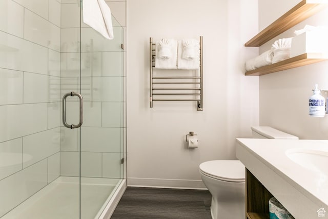 2670 Canyons Resort Dr Unit 214, Park City, UT 84098 - full bathroom featuring radiator heating unit, wood finished floors, a stall shower, vanity, and a towel warmer