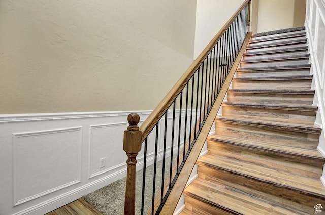 429 W 350 N Unit 4, Tremonton, UT 84337 - stairway featuring wood finished floors, a decorative wall, and wainscoting