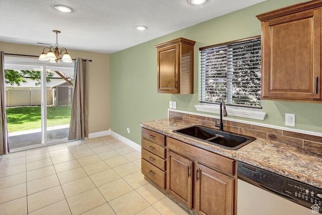 429 W 350 N Unit 4, Tremonton, UT 84337 - kitchen with dishwasher, light tile patterned floors, pendant lighting, a chandelier, and stone countertops