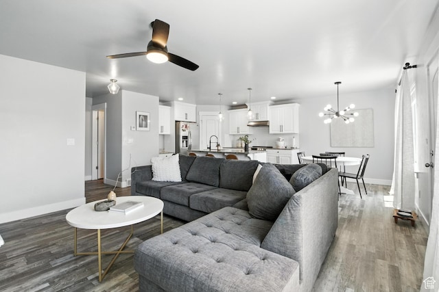 191 E 560 N, Salem, UT 84653 - living area with wood finished floors, a chandelier, ceiling fan, and recessed lighting