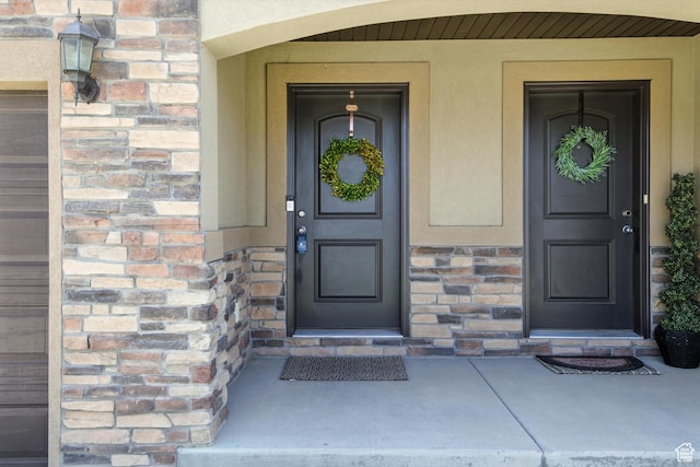 191 E 560 N, Salem, UT 84653 - view of exterior entry featuring stone siding, stucco siding, and covered porch