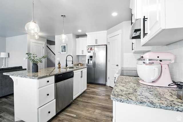 191 E 560 N, Salem, UT 84653 - kitchen with appliances with stainless steel finishes, exhaust hood, dark wood finished floors, an island with sink, and white cabinets