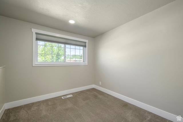 5729 S 150 W, Murray, UT 84107 - spare room featuring dark carpet, a textured ceiling, and recessed lighting