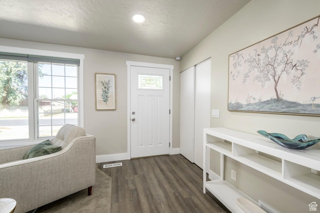 5729 S 150 W, Murray, UT 84107 - foyer entrance with dark wood finished floors, a textured ceiling, and recessed lighting