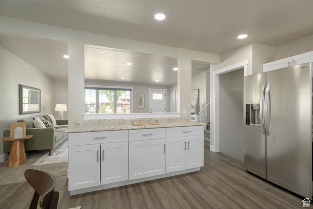 5729 S 150 W, Murray, UT 84107 - kitchen with stainless steel fridge with ice dispenser, white cabinetry, dark wood finished floors, recessed lighting, and open floor plan